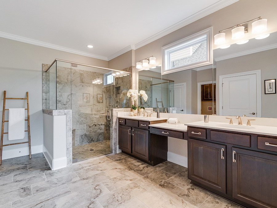 Universal design trends like raised vanities and walk-in showers with bench seating. 